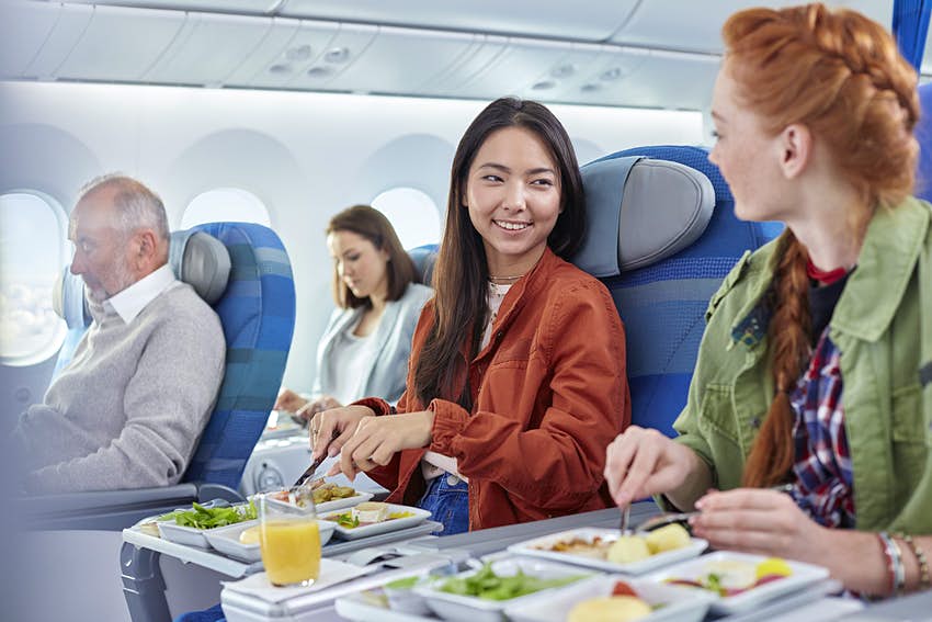 Passengers treating their taste buds with food on an airplane